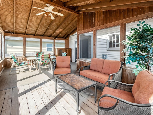 sunroom / solarium featuring outdoor dining area, outdoor lounge area, beam ceiling, and a ceiling fan
