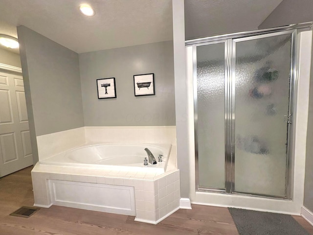 33 Hampden Dr, Granville, OH 43023 - full bathroom featuring a bath, a shower stall, and wood finished floors