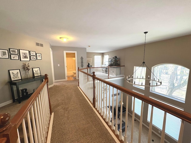 33 Hampden Dr, Granville, OH 43023 - corridor featuring a chandelier, carpet floors, an upstairs landing, and baseboards