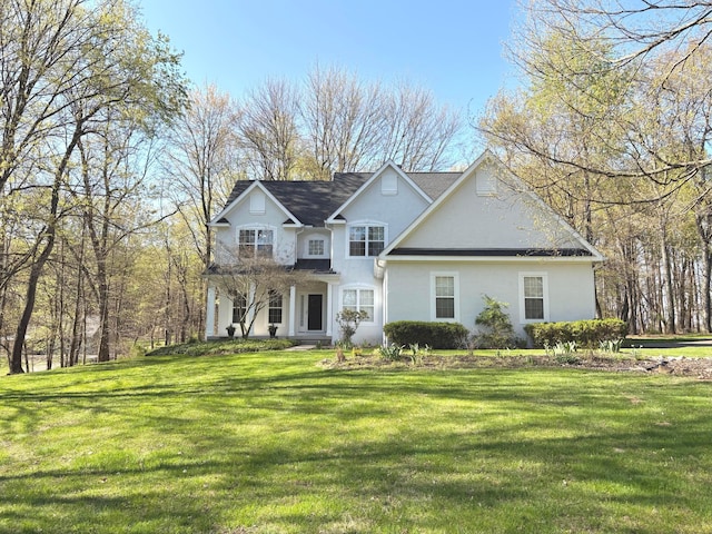 33 Hampden Dr, Granville, OH 43023 - traditional-style house with stucco siding and a front lawn