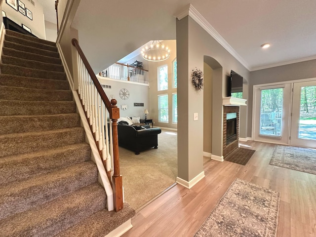 33 Hampden Dr, Granville, OH 43023 - foyer featuring ornamental molding, stairs, wood finished floors, baseboards, and a chandelier