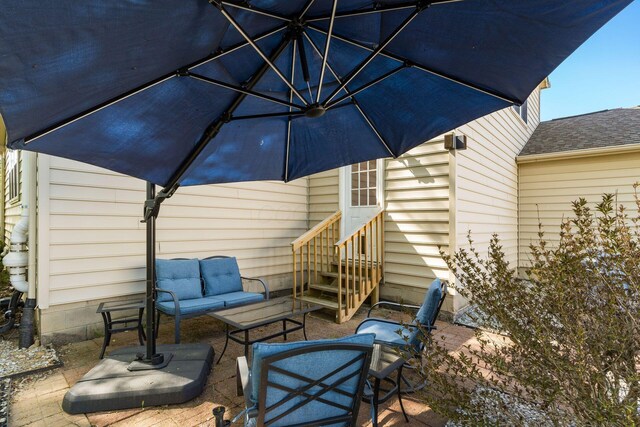 view of patio featuring outdoor lounge area and entry steps