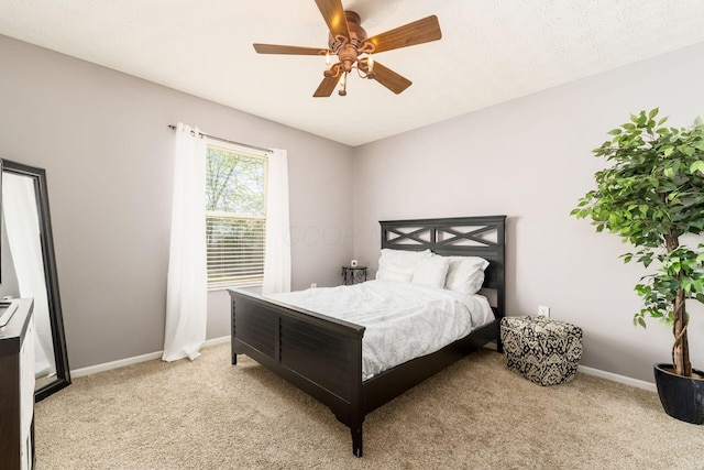 bedroom with baseboards, light colored carpet, and ceiling fan
