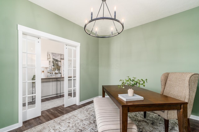 home office featuring a chandelier, baseboards, french doors, and dark wood finished floors