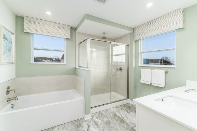 bathroom with a sink, a shower stall, a bath, a healthy amount of sunlight, and marble finish floor