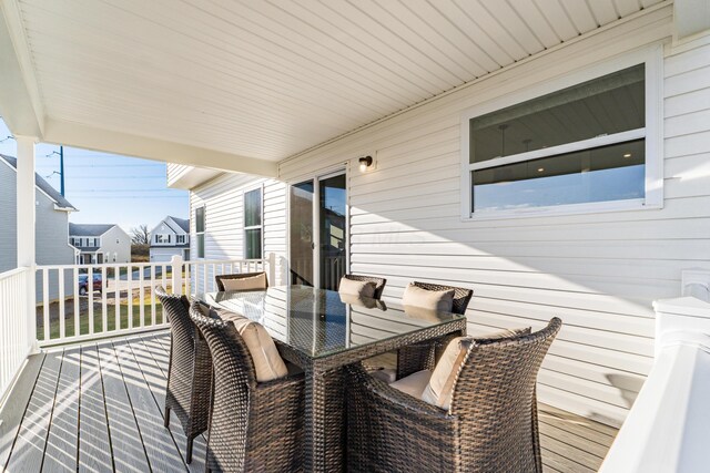 wooden deck with outdoor dining area