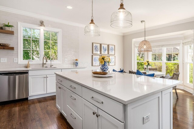 kitchen with dark wood-style floors, light countertops, open shelves, stainless steel dishwasher, and a sink