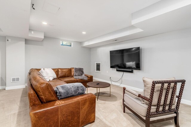living area featuring recessed lighting, baseboards, visible vents, and light colored carpet