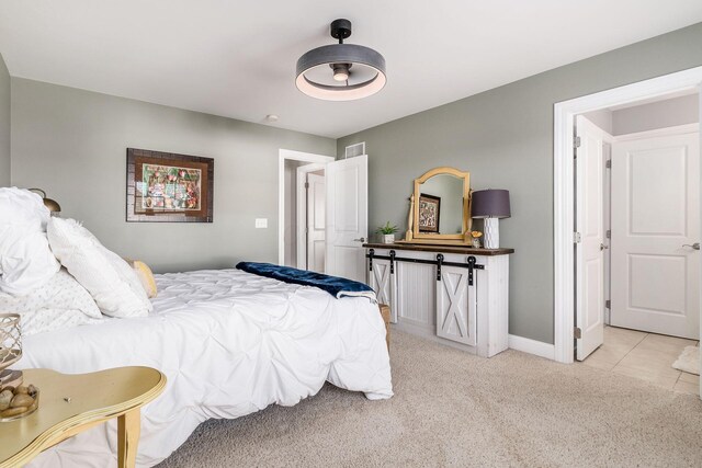 bedroom featuring light carpet, visible vents, and baseboards