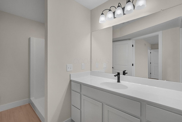 108 Cumberland Meadows Cir, Hebron, OH 43025 - bathroom with vanity, wood finished floors, baseboards, and a shower