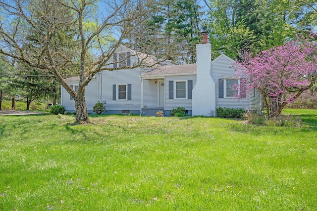 2575 Jordan Rd, Columbus, OH 43231 - view of front facade with a front lawn and a chimney