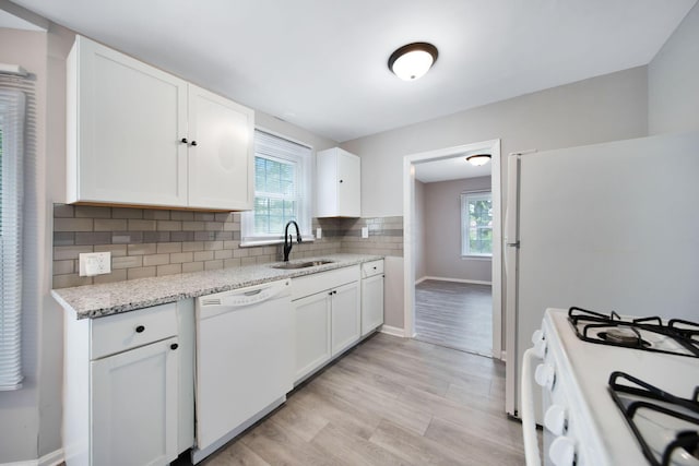 2575 Jordan Rd, Columbus, OH 43231 - kitchen featuring white appliances, a sink, and white cabinetry