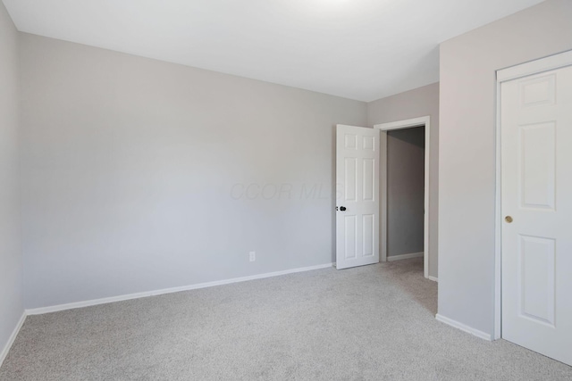 2575 Jordan Rd, Columbus, OH 43231 - unfurnished bedroom featuring baseboards and light colored carpet