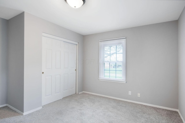 2575 Jordan Rd, Columbus, OH 43231 - unfurnished bedroom featuring baseboards, carpet flooring, and a closet
