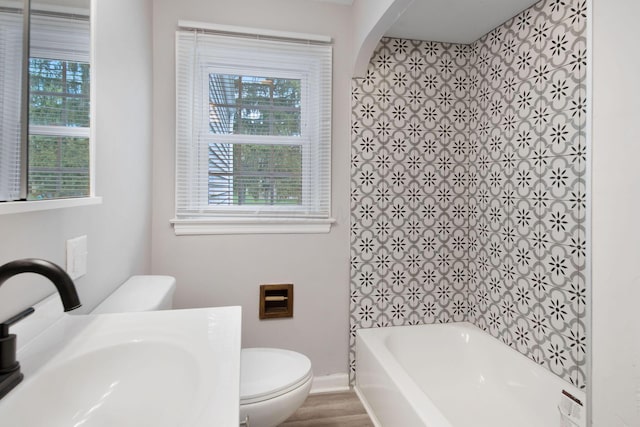 2575 Jordan Rd, Columbus, OH 43231 - bathroom featuring a wealth of natural light, toilet, and a sink