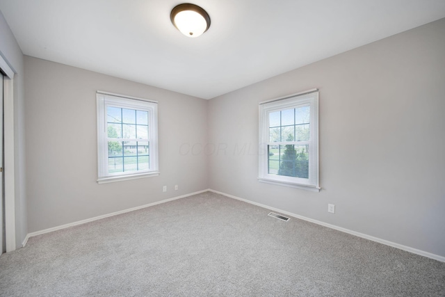 2575 Jordan Rd, Columbus, OH 43231 - carpeted empty room with plenty of natural light, visible vents, and baseboards