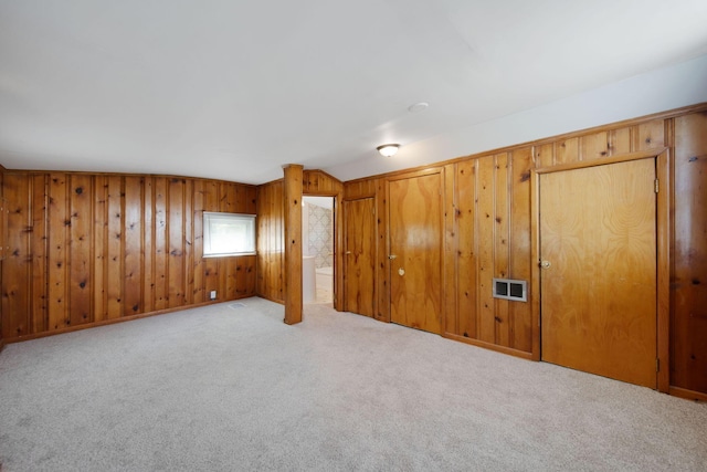 2575 Jordan Rd, Columbus, OH 43231 - empty room with wooden walls, carpet flooring, and visible vents