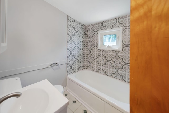 2575 Jordan Rd, Columbus, OH 43231 - bathroom with toilet, tile patterned floors, a sink, and a bathtub