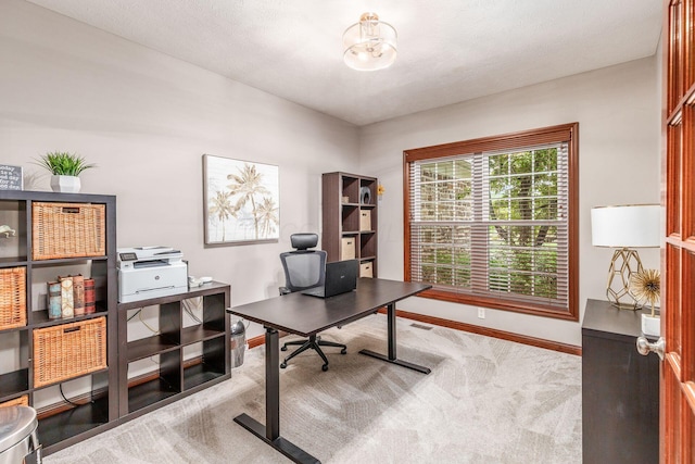 office with carpet floors, baseboards, and a chandelier