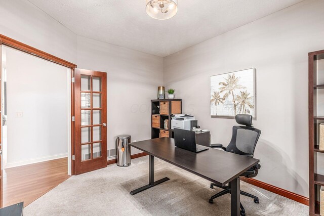 office area featuring baseboards and french doors