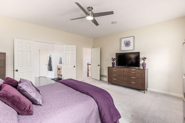 bedroom with baseboards, ceiling fan, and light carpet
