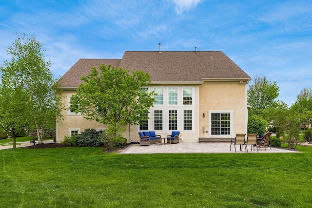 back of house with outdoor lounge area, stucco siding, a shingled roof, a patio area, and a lawn