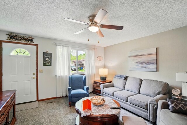 2680 Mellowbrook St, Columbus, OH 43232 - living room with a textured ceiling, a ceiling fan, light carpet, and baseboards
