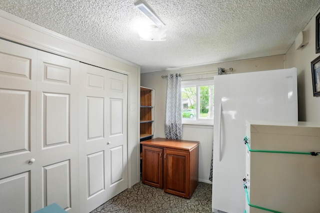 2680 Mellowbrook St, Columbus, OH 43232 - interior space featuring freestanding refrigerator, a closet, a textured ceiling, and baseboards