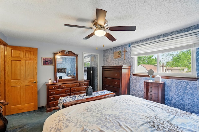 2680 Mellowbrook St, Columbus, OH 43232 - bedroom with dark colored carpet, multiple windows, a textured ceiling, wallpapered walls, and ceiling fan