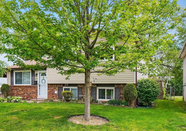 2680 Mellowbrook St, Columbus, OH 43232 - view of front of house with brick siding and a front yard
