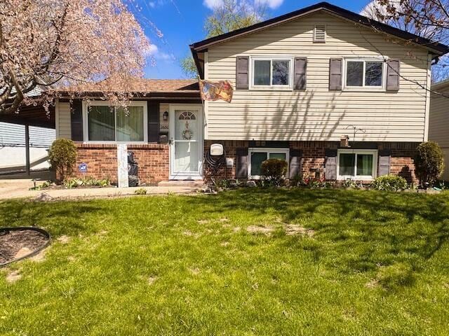 2680 Mellowbrook St, Columbus, OH 43232 - tri-level home with brick siding and a front lawn