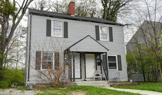 view of front of house featuring a chimney