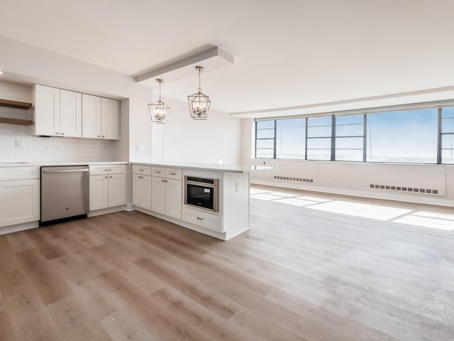 1620 E Broad St Unit 1106, Columbus, OH 43203 - kitchen featuring appliances with stainless steel finishes, open shelves, a chandelier, a peninsula, and light wood-style flooring