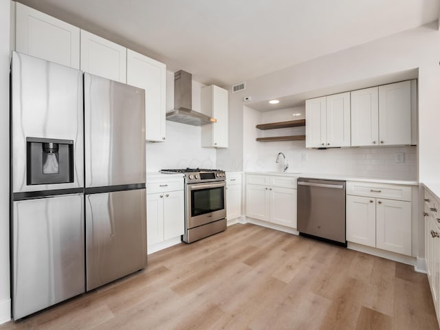 1620 E Broad St Unit 1106, Columbus, OH 43203 - kitchen with appliances with stainless steel finishes, wall chimney range hood, light wood-style floors, open shelves, and a sink