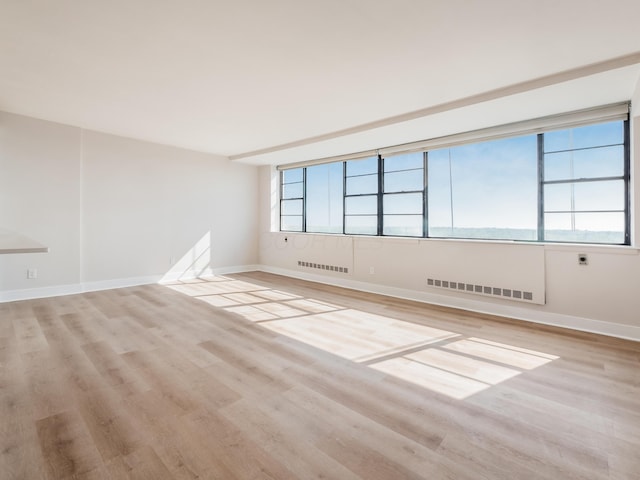 1620 E Broad St Unit 1106, Columbus, OH 43203 - spare room featuring light wood finished floors and baseboards