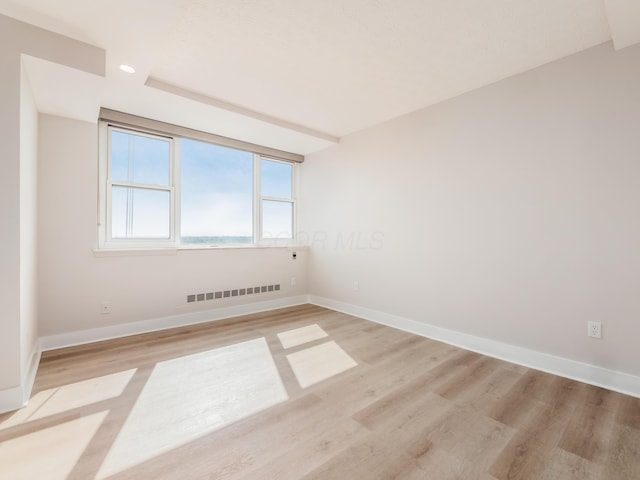 1620 E Broad St Unit 1106, Columbus, OH 43203 - spare room featuring light wood-style flooring, baseboards, and recessed lighting