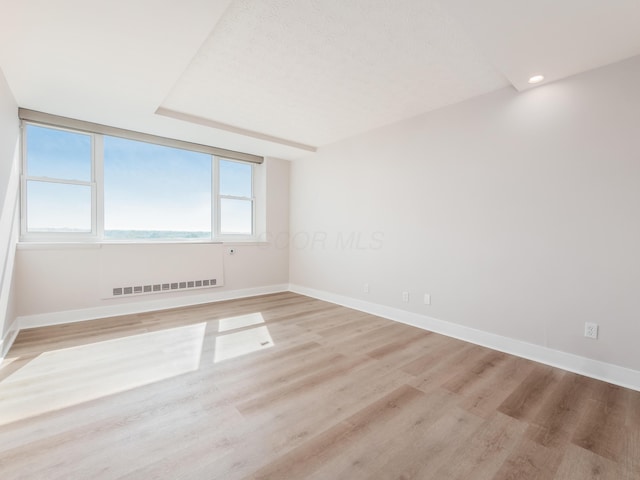1620 E Broad St Unit 1106, Columbus, OH 43203 - unfurnished room featuring baseboards, light wood-style floors, and recessed lighting