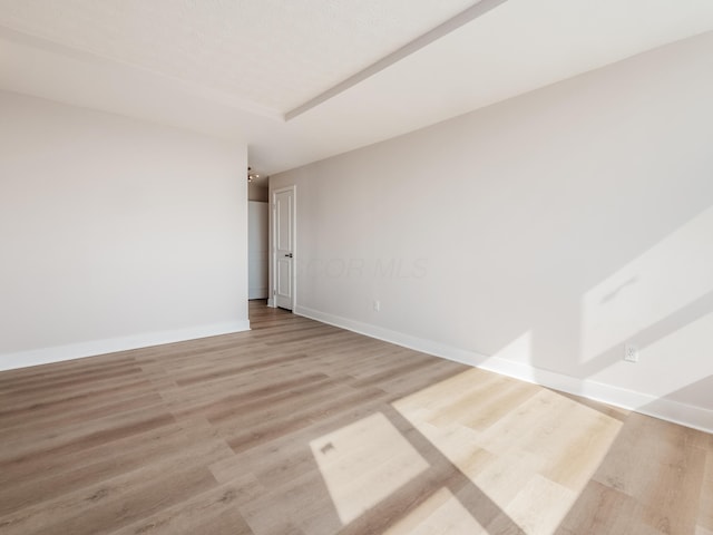 1620 E Broad St Unit 1106, Columbus, OH 43203 - spare room with light wood finished floors and baseboards