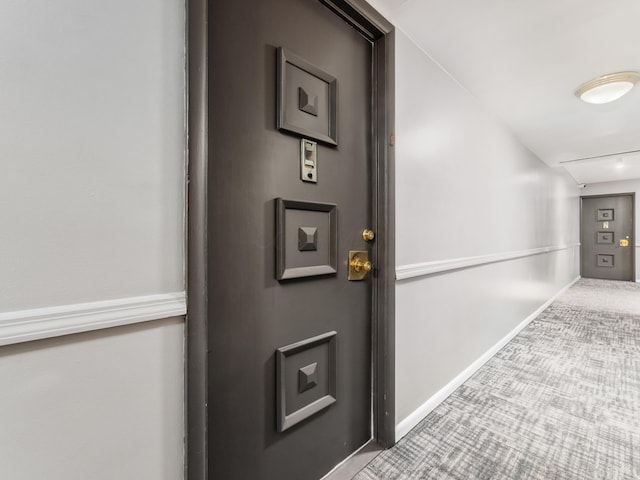 1620 E Broad St Unit 1106, Columbus, OH 43203 - hall featuring attic access, carpet flooring, and baseboards
