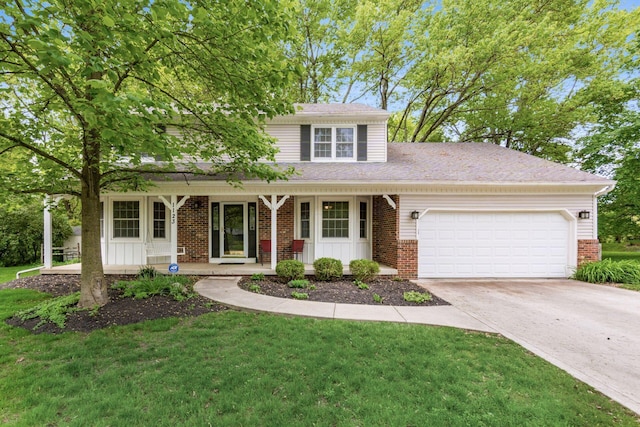 1123 Firth Ave, Worthington, OH 43085 - traditional home with brick siding, covered porch, a garage, and driveway