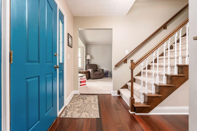 1123 Firth Ave, Worthington, OH 43085 - entrance foyer with baseboards, stairway, dark wood-style floors, and a textured ceiling