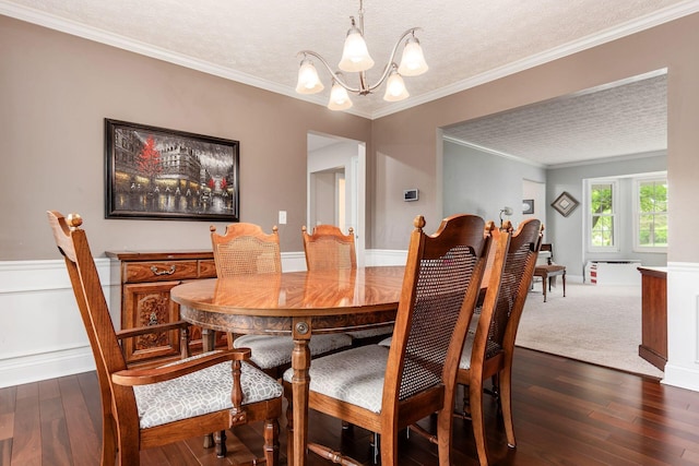 1123 Firth Ave, Worthington, OH 43085 - dining room with a chandelier, a textured ceiling, dark wood-style flooring, and ornamental molding