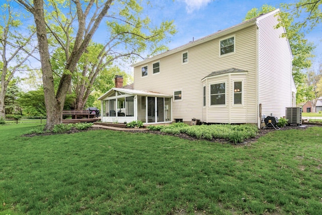 1123 Firth Ave, Worthington, OH 43085 - rear view of house featuring a sunroom, cooling unit, and a chimney