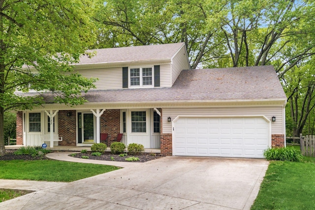1123 Firth Ave, Worthington, OH 43085 - traditional home with brick siding, concrete driveway, a garage, covered porch, and roof with shingles