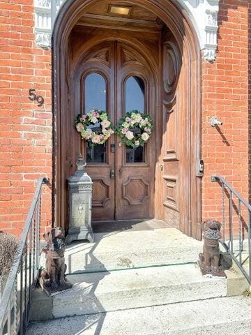 59 S Chillicothe St, South Charleston, OH 45368 - view of exterior entry with brick siding and french doors
