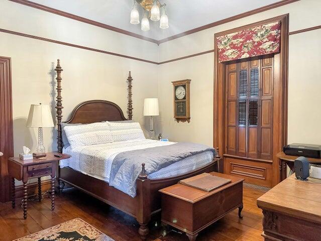 59 S Chillicothe St, South Charleston, OH 45368 - bedroom featuring hardwood / wood-style flooring and crown molding