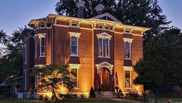 59 S Chillicothe St, South Charleston, OH 45368 - italianate-style house with a chimney, brick siding, and a fenced front yard