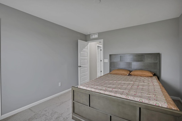 121 E Wind Rd, Delaware, OH 43015 - bedroom with light colored carpet, visible vents, and baseboards