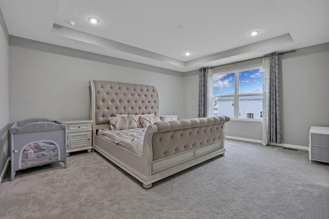121 E Wind Rd, Delaware, OH 43015 - carpeted bedroom with baseboards, a raised ceiling, and recessed lighting