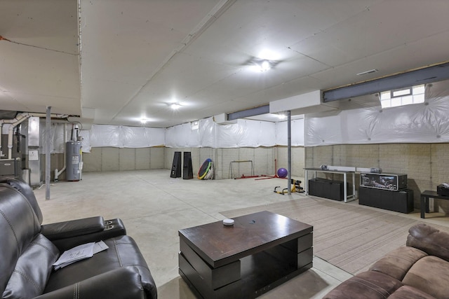 121 E Wind Rd, Delaware, OH 43015 - interior space featuring concrete floors and water heater